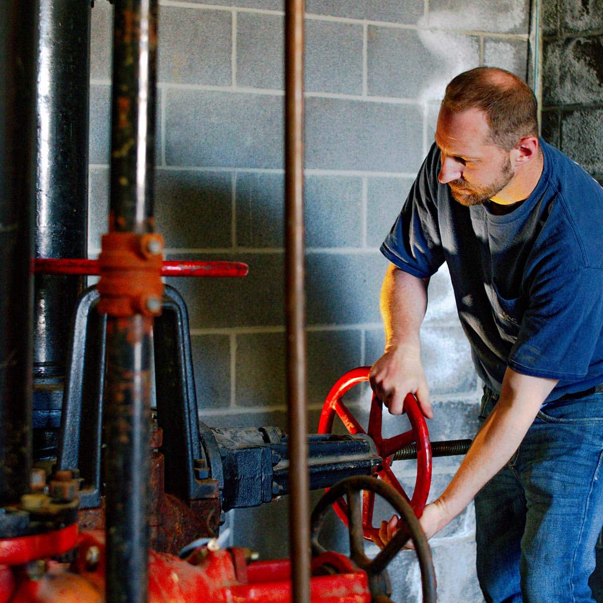 DMC technician repairing a commercial boiler