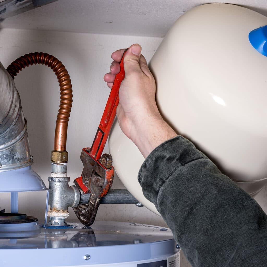 Tightening a pipe on a water heater