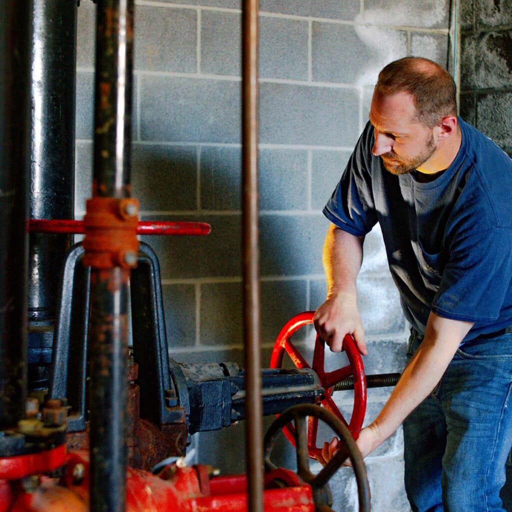 DMC technician fixing a boiler